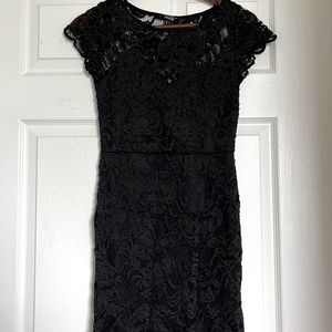 Black lace fitted mini dress with see-through back